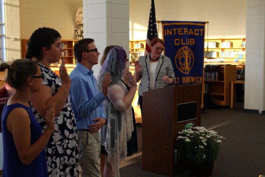Students participate in an initiation ceremony to 
become official members of Interact. 
Credit: Brooke Kesky
