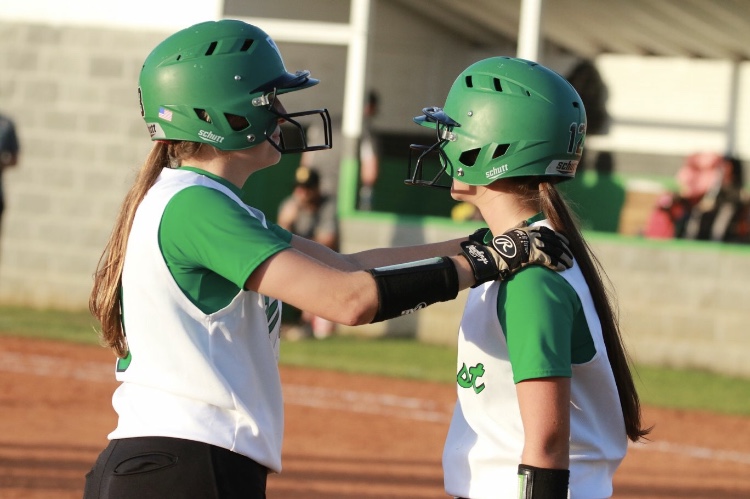 Cierra Watts and Kaitlyn Rhea share a moment during the game