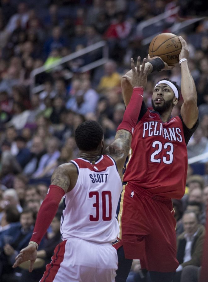 Anthony Davis  of the New Orleans Pelicans shoots over a defender.
