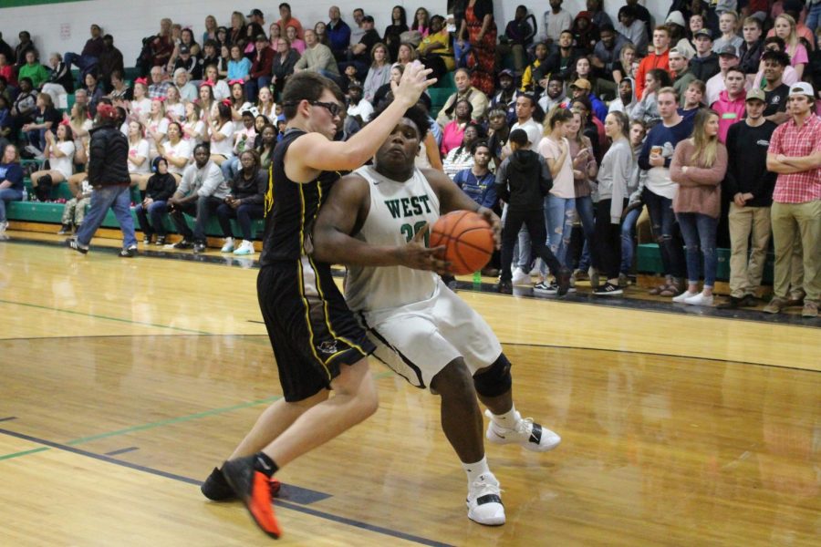 Javian+McCray+pushes+past+topsail+defender+to+make+a+layup