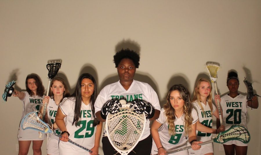 The Womens Lacrosse seniors stare into the camera at their media day.