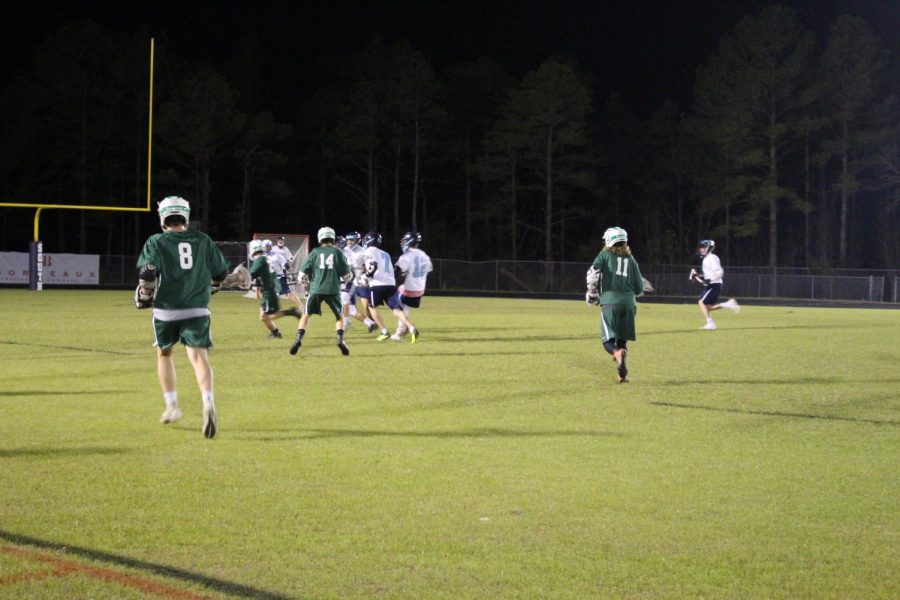 Austin Simmons (left) and Braxton Powell (right) sprint down the field towards the opposing goal. 