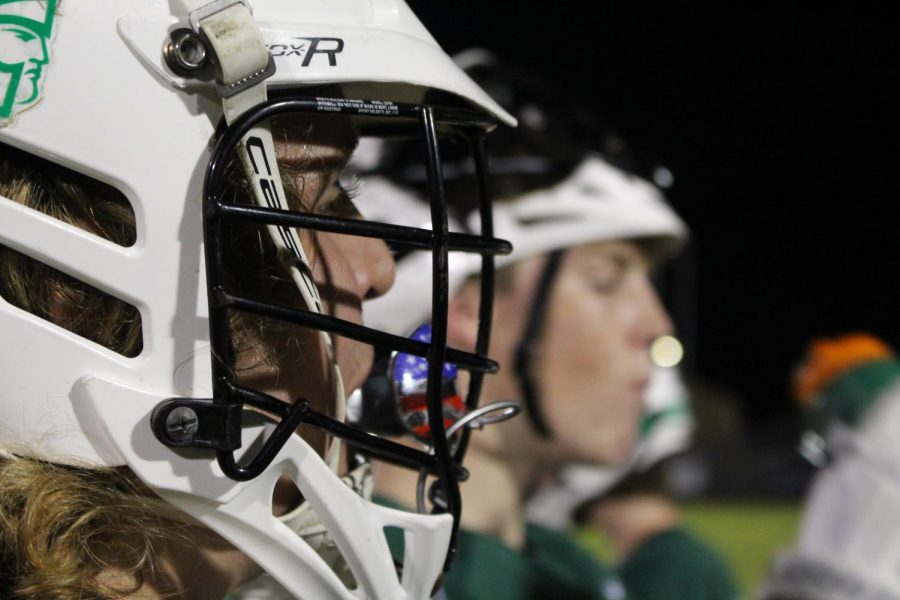 Braxton Powell listens closely to Coach Al Martin in the mid-half break. 