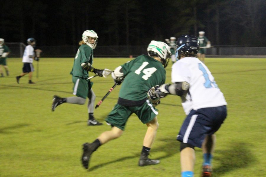 Ryan Wagner attempts to shake off a defender as he moves the ball over half-field