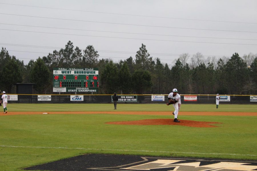 Senior Shawn Smith pitches the ball across home plate.