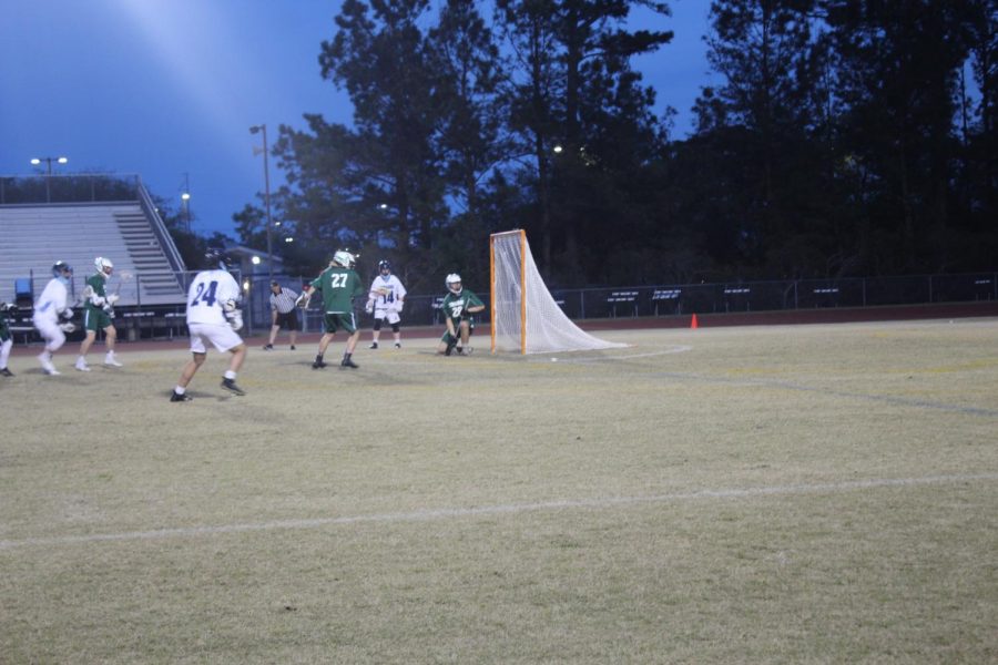 Junior goalkeeper, Will Pickard makes a save in the 1st quarter.
