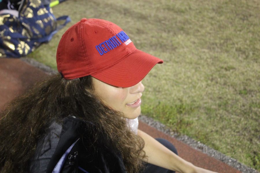 Cecelia Vergara represents her college as she watches the womens lacrosse game.
