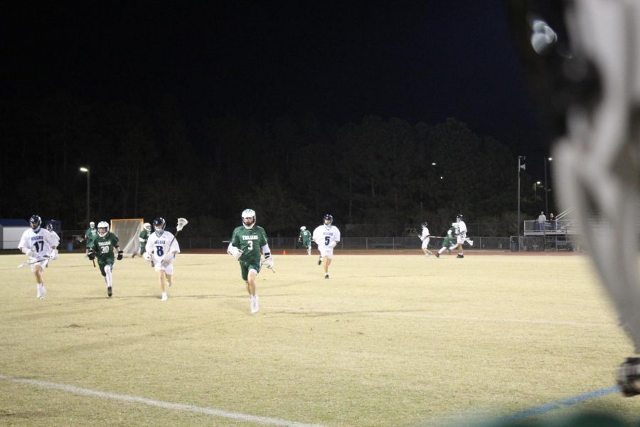 Trojan Defensemen and Viking Attackers rush to the sideline after the ball is transitioned to Hoggards defensive end. 