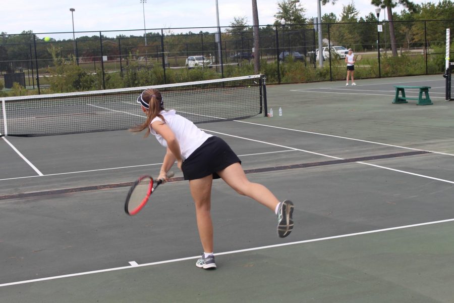 Kayla Ward serving an overhand to her opponent.
Photo by: Joshua Warren