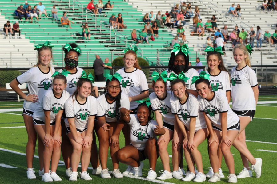 The West Brunswick Cheer Team poses for a photo before the game.