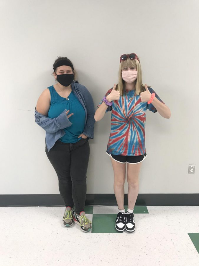 Emma Yando and Autumn Smith show trojan pride for decades day. 