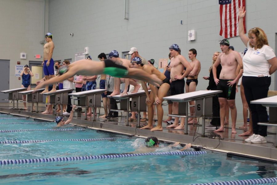 Abram Norton diving into the pool.