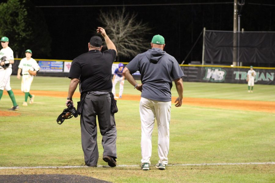 Coach Pardue and the umpire meet to talk after Laneys player was safe at first. 