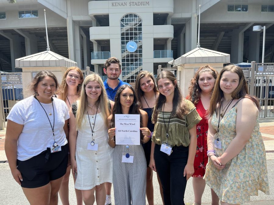 West Wind Staffers and Karleigh Quinn of the Early College pose in front of Kenan Stadium with the “All North Carolina” evaluation certificate.