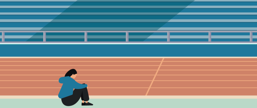 Athlete sits on track with head down as if struggling with something emotionally