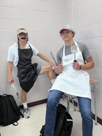 Juniors Tanner Fields and Adler Rice pose as grill dads. 