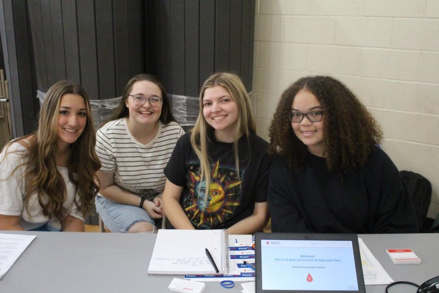 West Brunswick HOSA members, Willow Peltier (left), Jewelie Gore, Zoey Boswell, and Logan Franklin (right) help to check in donates in. 