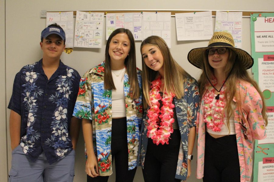 Freshmen Curtis Bruce, Paige Walker, Teagan Cosey, and Erin Cameron dressed up as surfers.