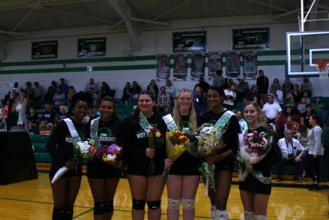 All 6 seniors gather around for a picture with their sashes on and flowers in hand.  

Photo Credit: Jenna Williams 