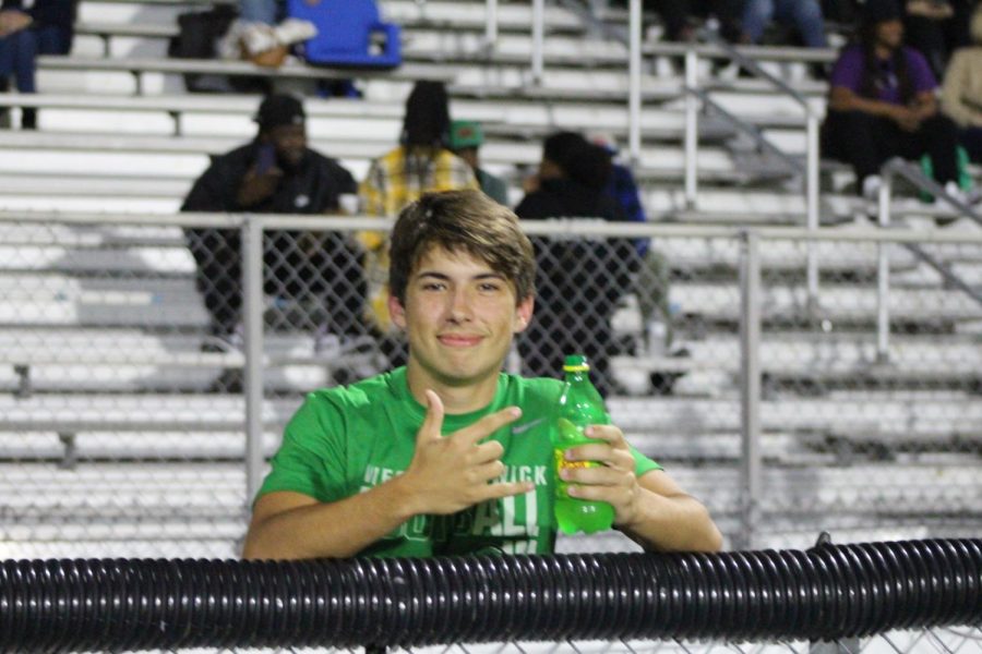 Jacob Rumsey poses for a photo during halftime.