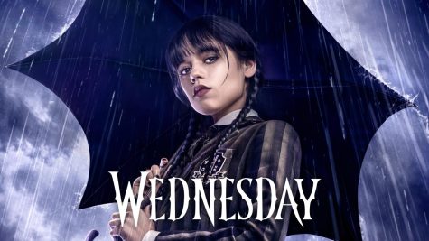 The character Wednesday from Netflixs new show Wednesday holding an umbrella.  