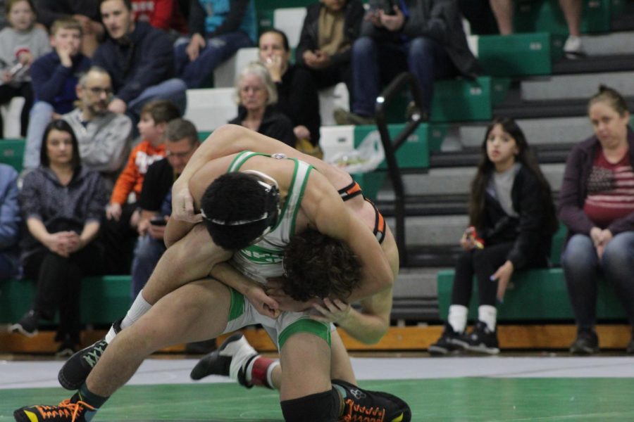 Leonel Rodriguez securing his hold on his competitor.