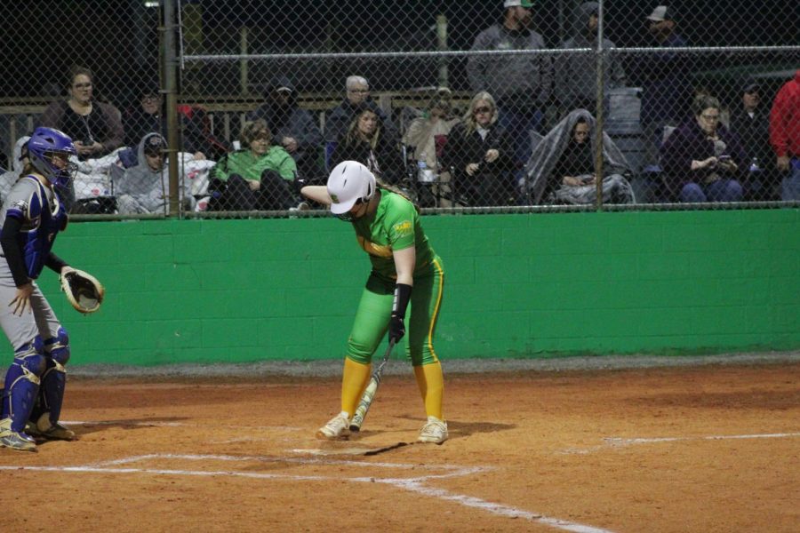 Makaylee Sanders, a junior walking up to the plate and calling time with the umpire.