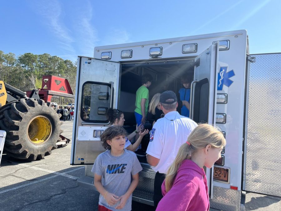 Fifth grade students coming out of the emergency evacuation vehicle. 