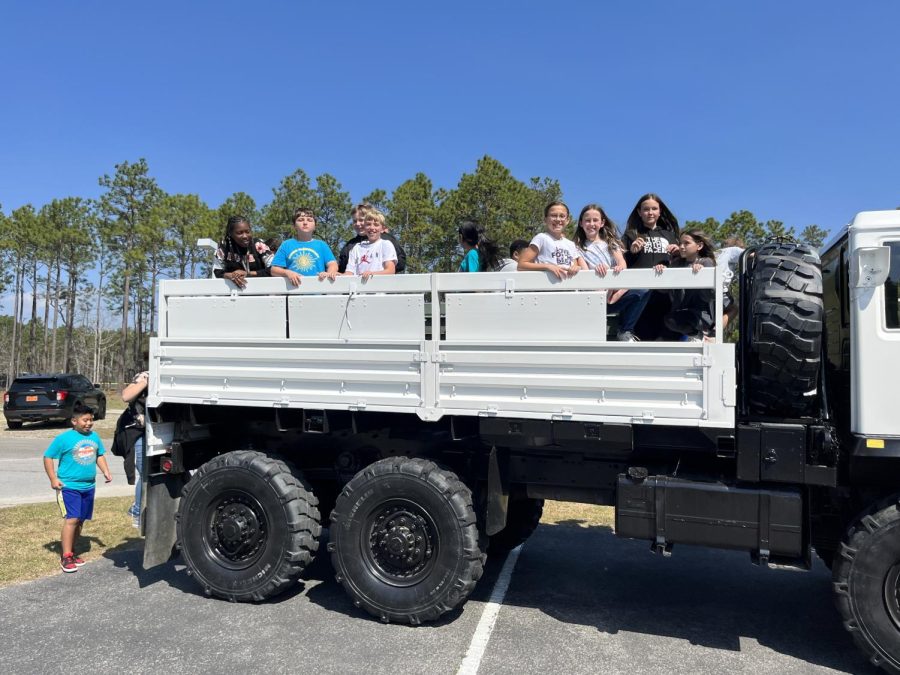 Students from Union Elementary exploring one of the vehicles at the event. 