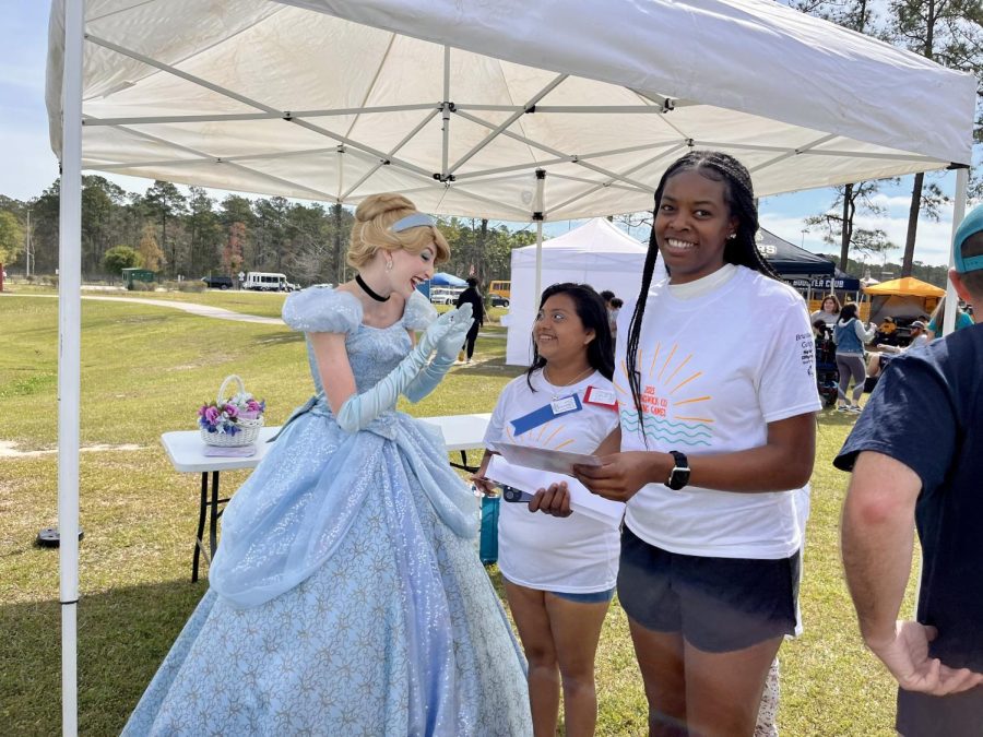 Jariya Morgan and Stacey Garcia Hernandez talking to the Disney princess, Cinderella. 