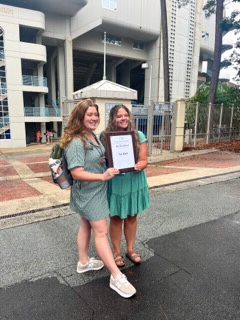 Editor-in-Chief Courtney Weston and adviser Anna Saunders pose with the Tar Heel.