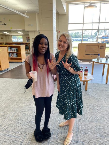 Senior Lavoria Hill standing with teacher for the deaf and hard of hearing Katie Smith.