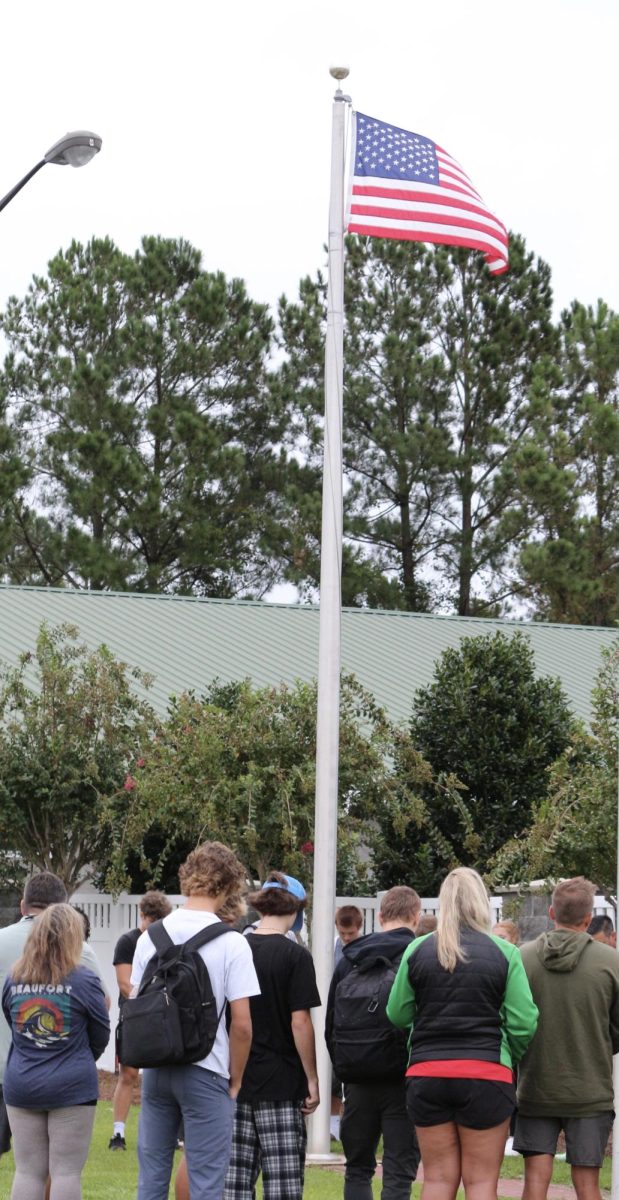 FCA members gather around the flag pole at 7:15 am for prayer.