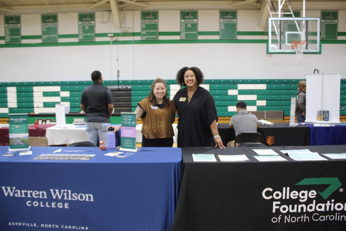 College admission representatives from Warren Wilson College and the College Foundation of North Carolina at their information tables.