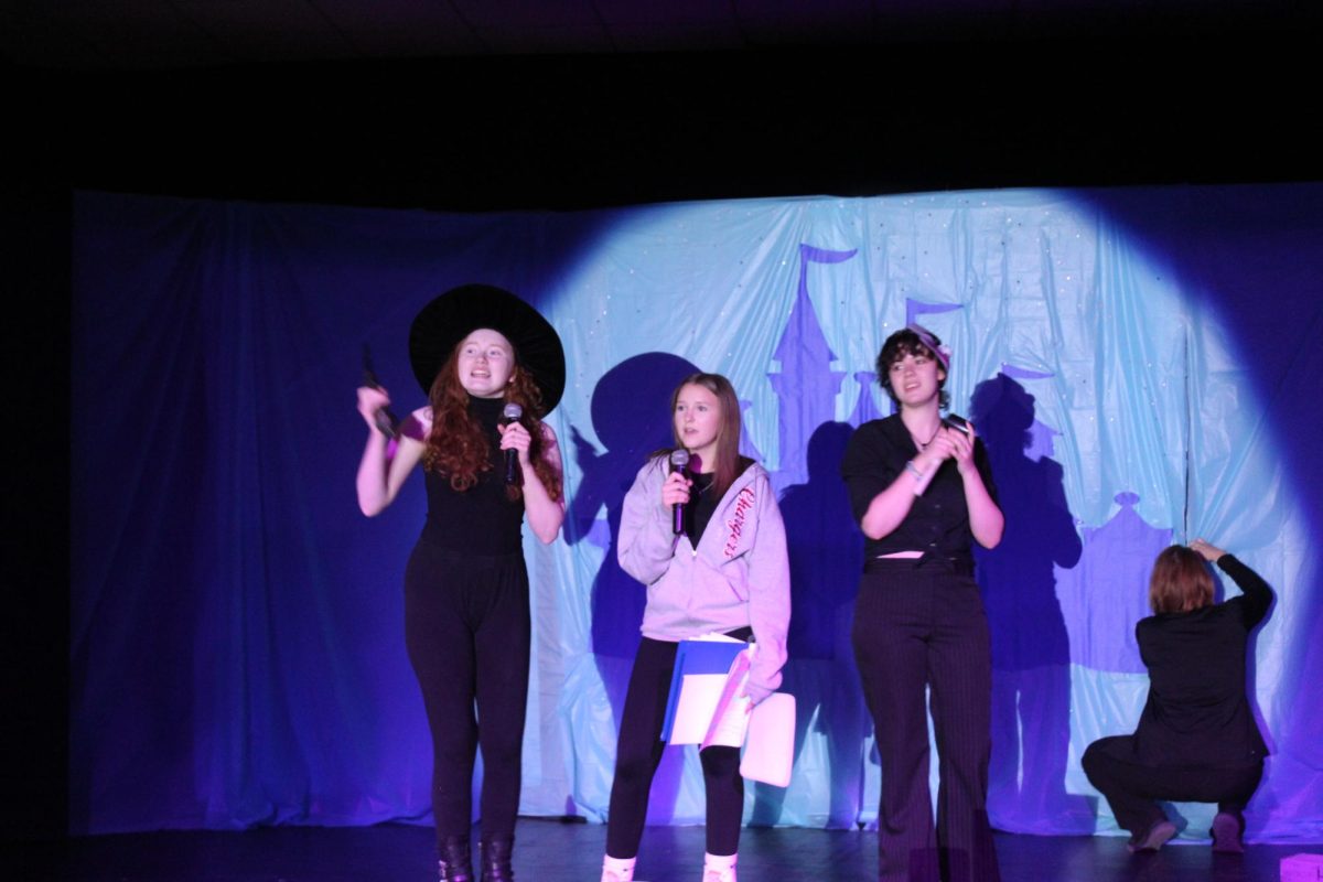 Kaia Nygaard, Betty Dykes, and Tiffany Guin performing Kidnap the Sandy Claus 