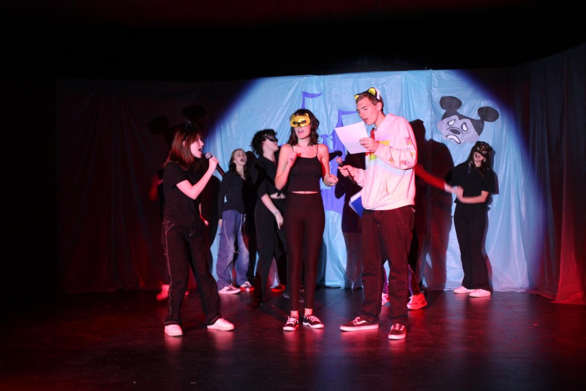 (From left to right) Delilah Miller, Robert Walling and Alexis Mullins perform Everybody Wants to be a Cat 