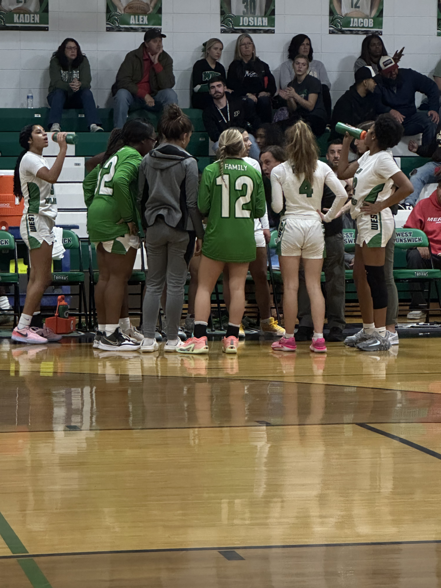 The varsity womens basketball team during a time out in the 3rd quarter. 
