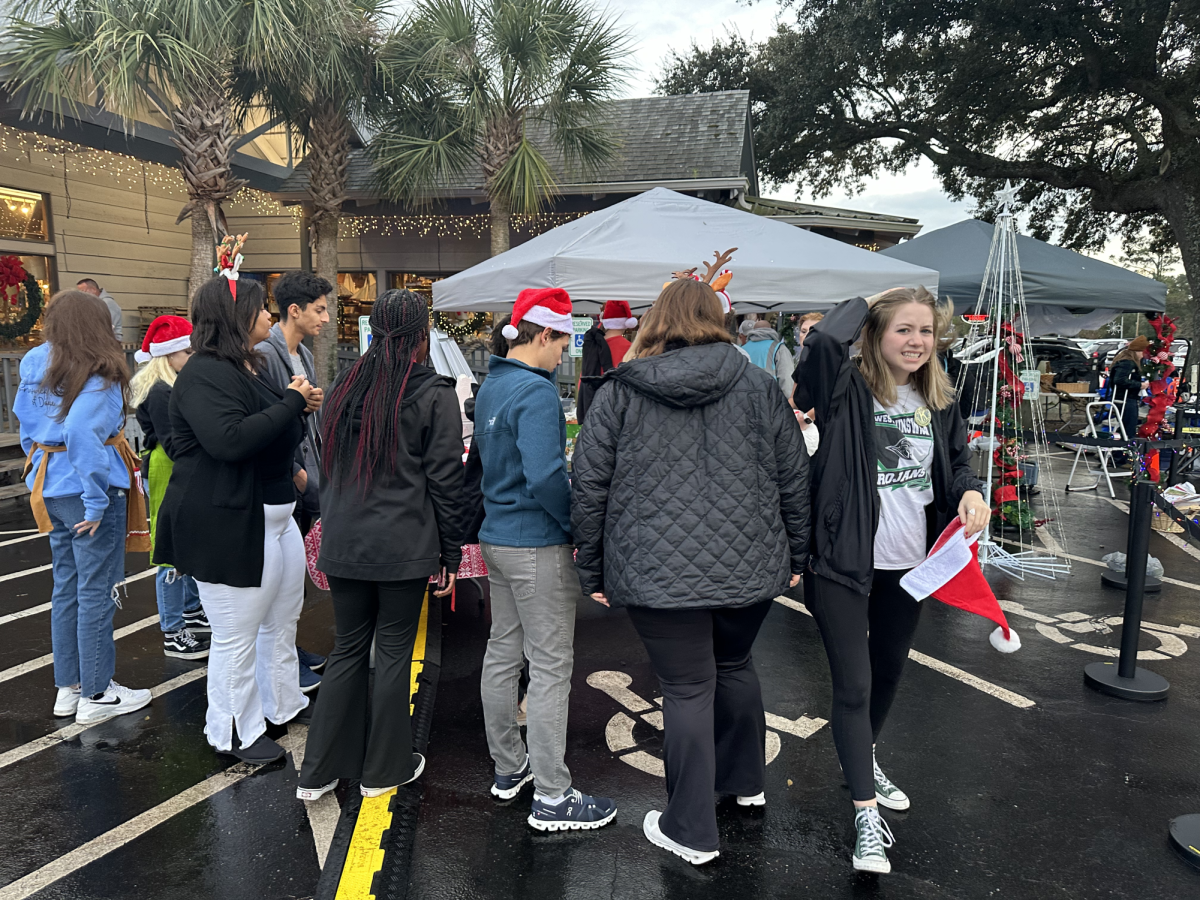 Volunteers from Key Club and NHS get to the parade early to help set up for the kids and adults. 