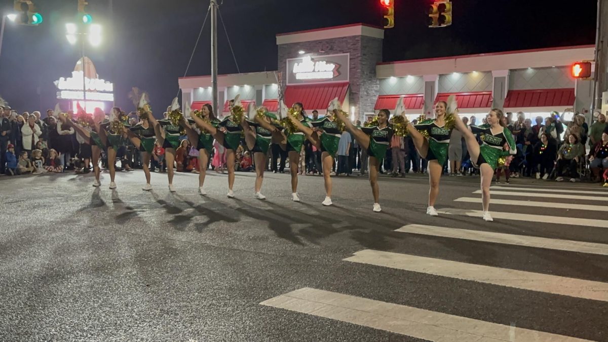 WBHS dance theme stops in the middle of the intersection to perform a dance to All I Want for Christmas Is You. 