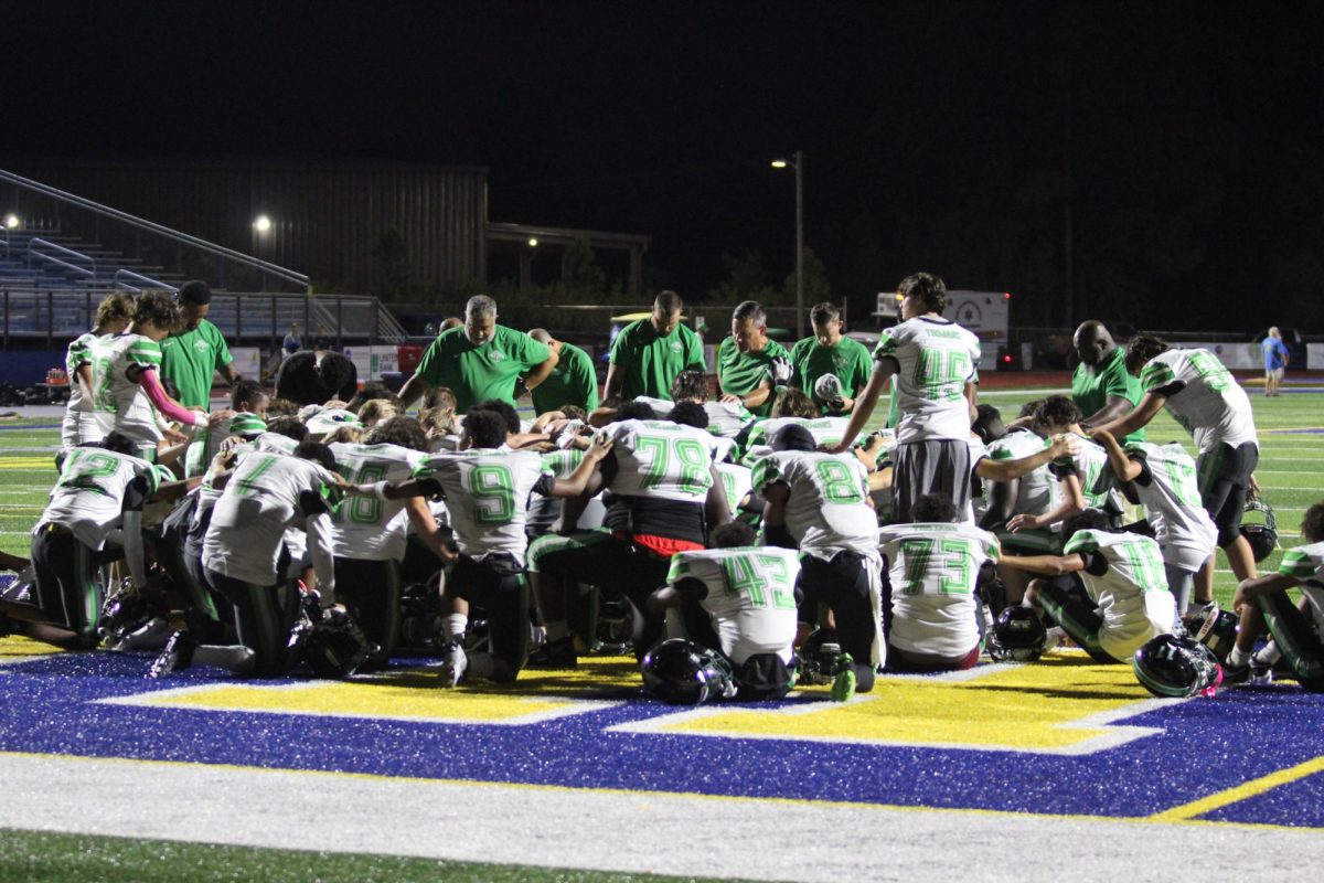 Coach Handy coming to meet all the boys after their long battle. After the game he gathered all the boys and led them in prayer.