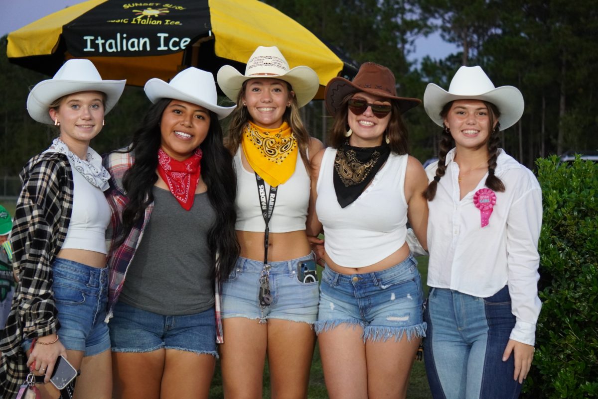 Fans showing their school pride for the western night theme