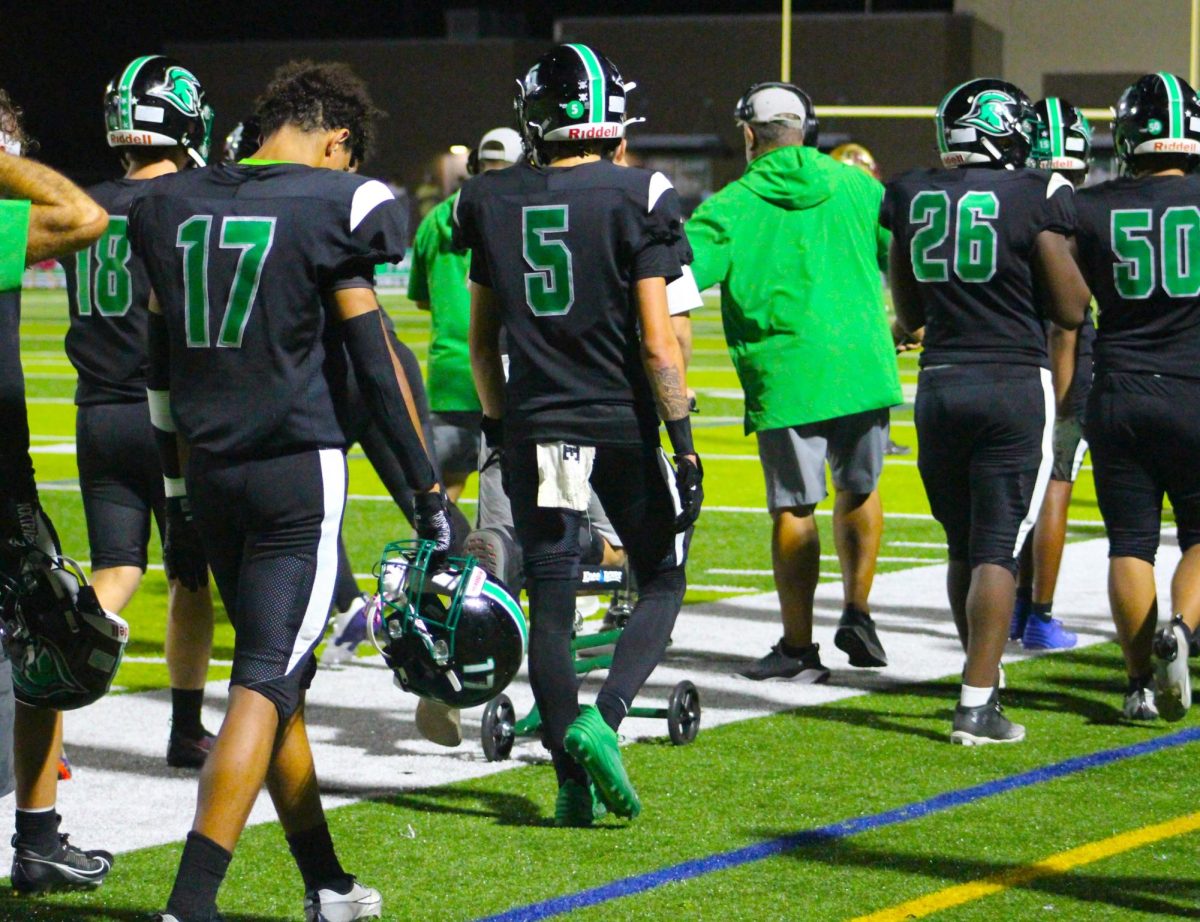 Trojans walking back to the field house for halftime.