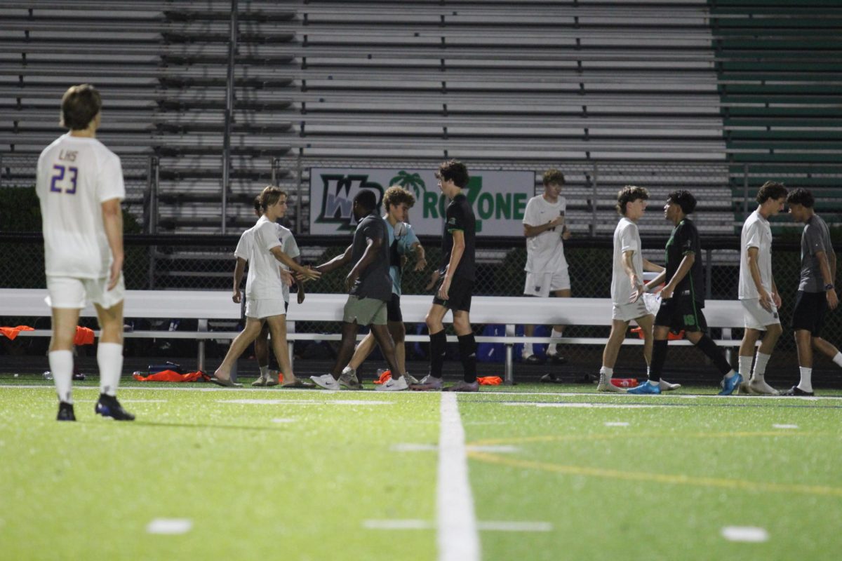 West and Laney shaking hands after the game ended.