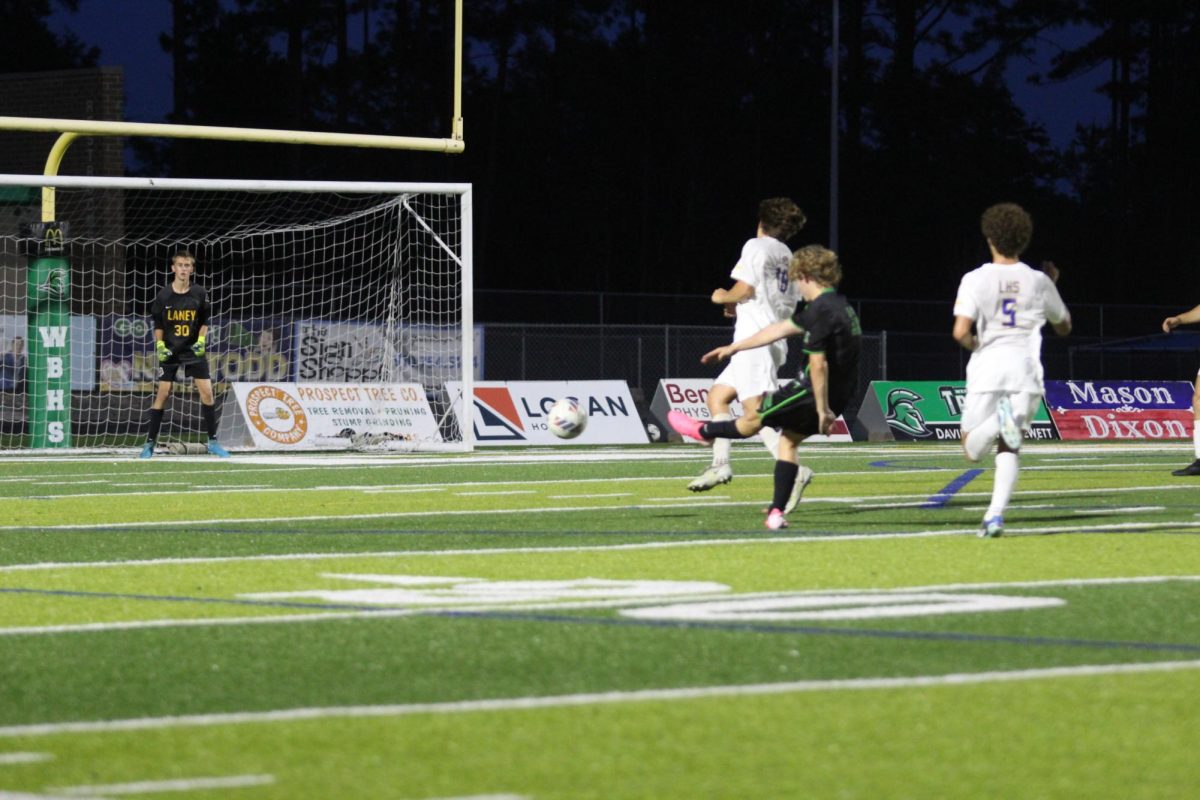 Garrett Granade kicks the ball and barely misses towards the top of the goal.