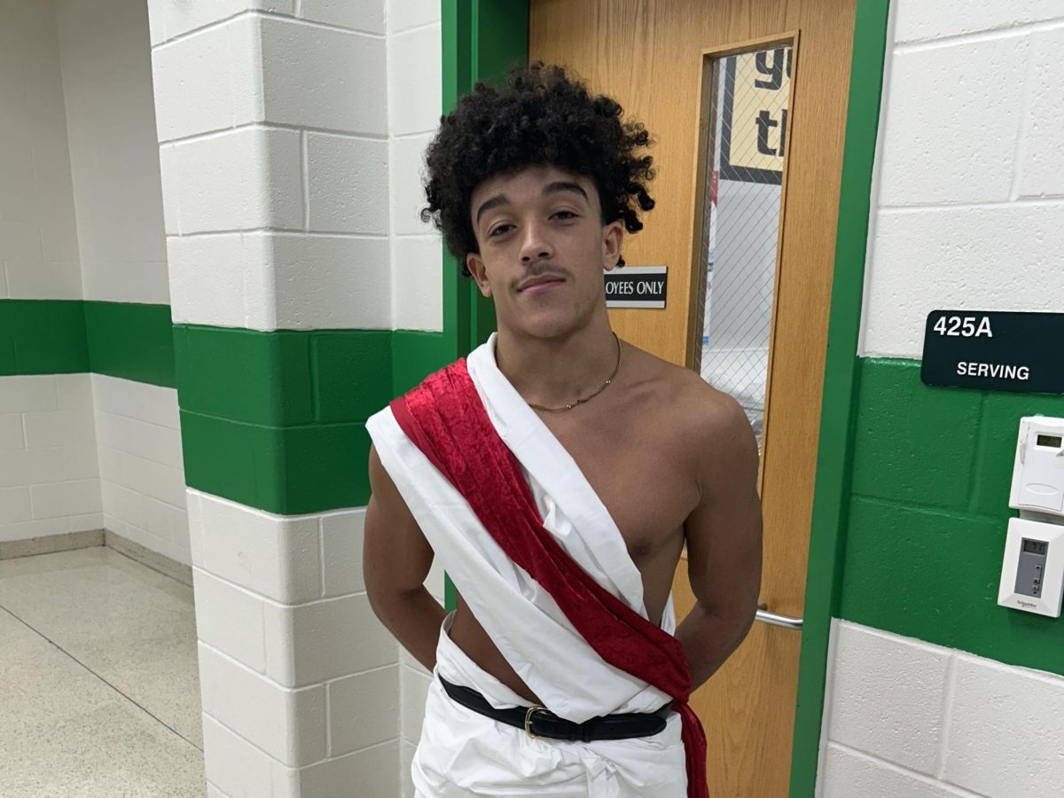 Senior Jared Schreck poses in his toga during breakfast. 