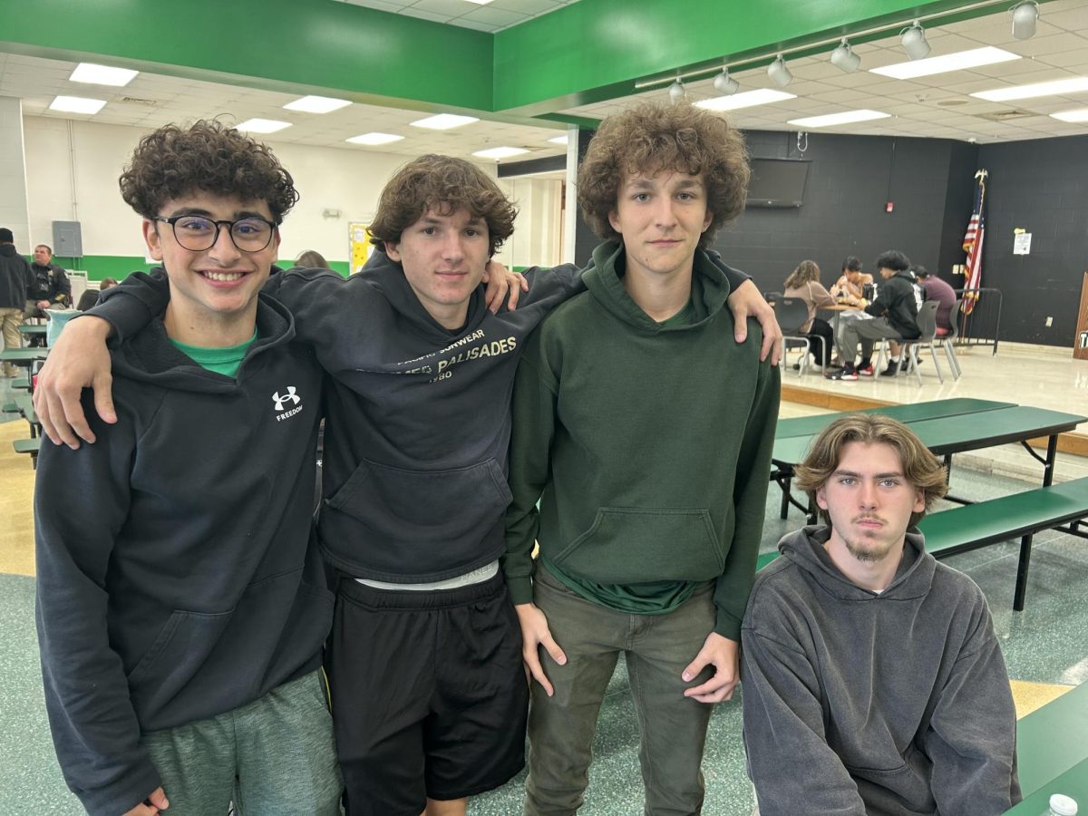 Juniors Nicholas Tantillo, Henry Phillips. Matthew Argo and Chase Griffith hanging around in their colors during lunch.