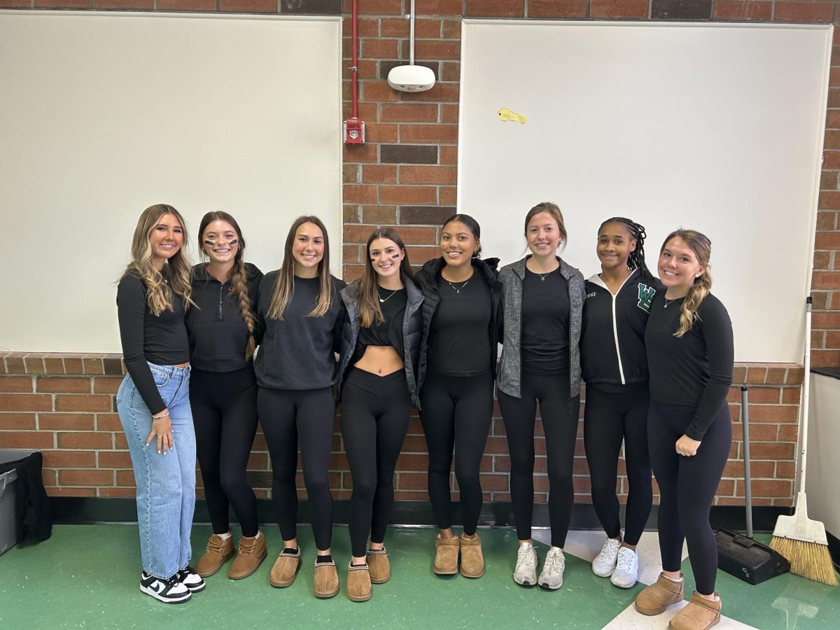 Juniors Teagan Cossey, Ella Ranson, Sadie Jones, Hailey Schiffer, Paige Walker, Syonna Smith and Autumn Wyatt smile for the camera during lunch. 