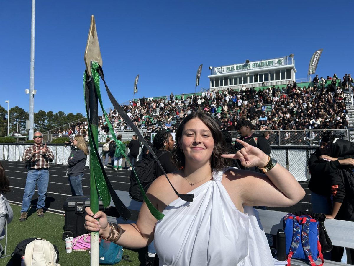 Senior class president Hannah Underwood rocks her toga after receiving the spirit stick. 