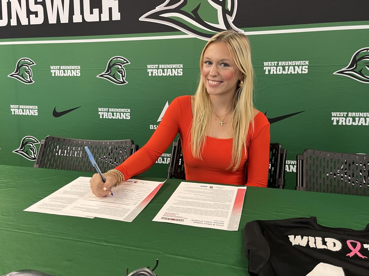 Senior Kaitlin Gould, posing for the camera excited and ready to sign to continue her academic and athletic career in college.