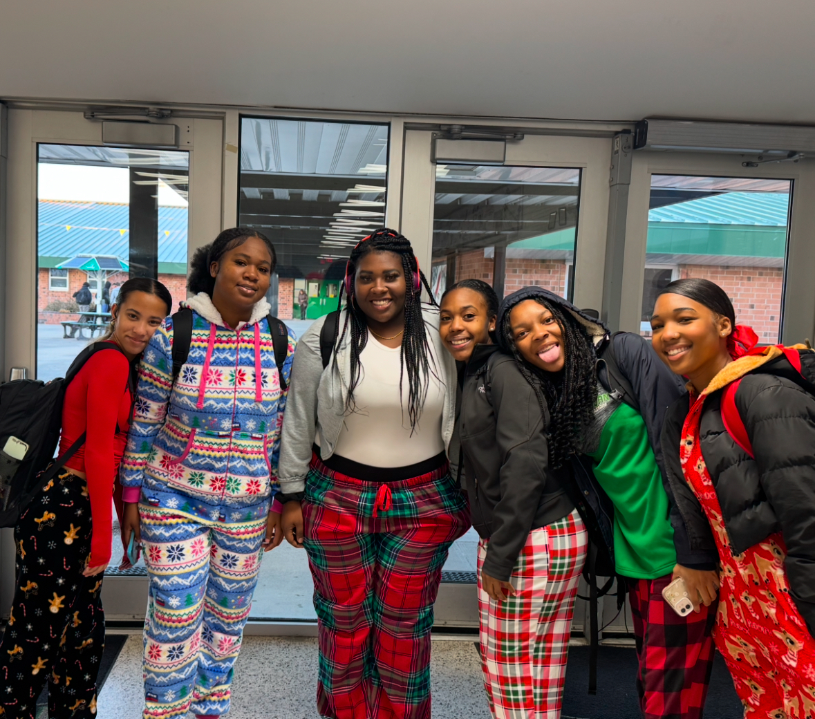 Sophomore Lilly Madibo,sophomore Tanyri Hill, Senior Ny'Ajah McCray, sophomore Anijah Gore, sophomore Deliylah Watts, and sophomore Tamia King dressed in their favorite Christmas pajamas. 